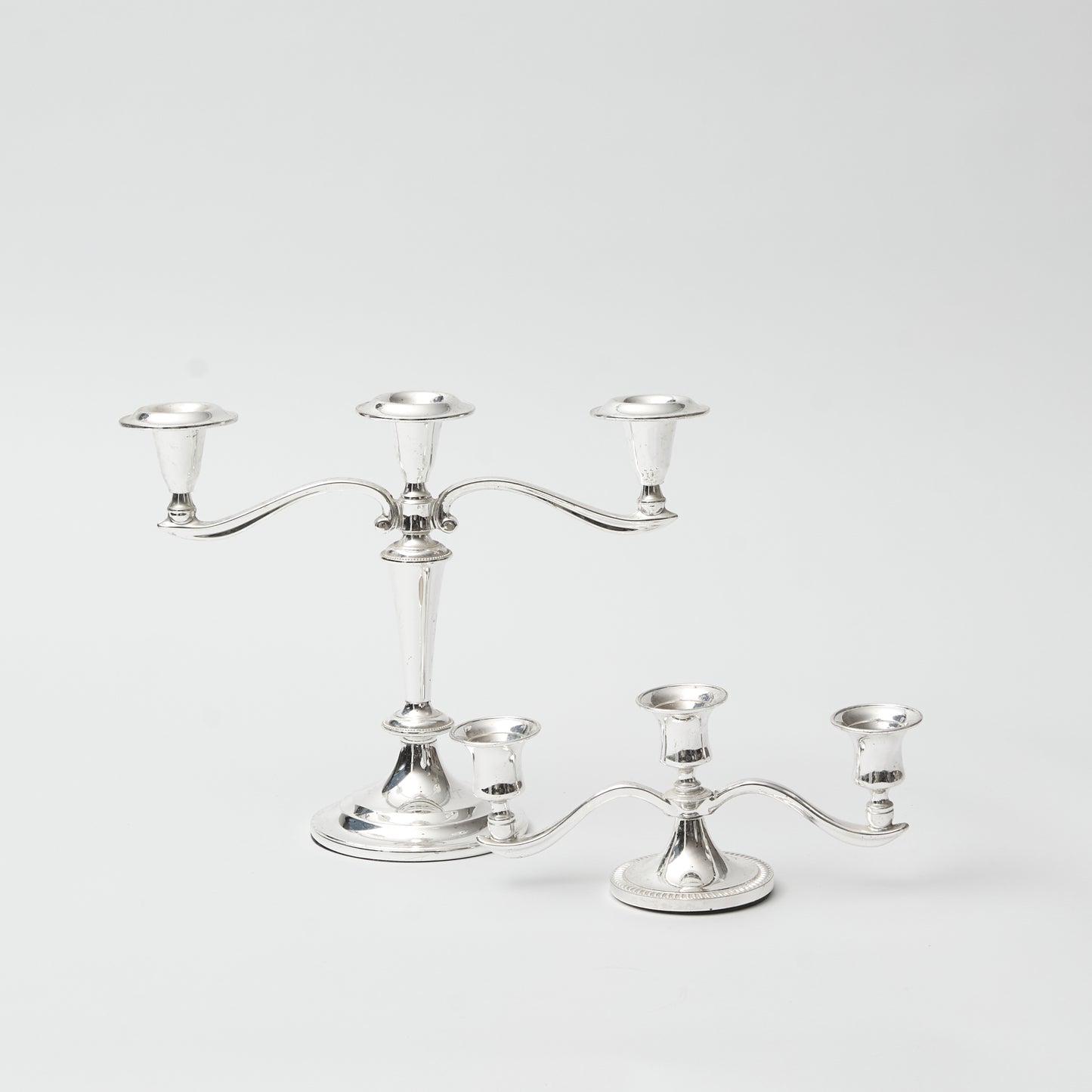 Pair of High-Low silver gilt Candlesticks