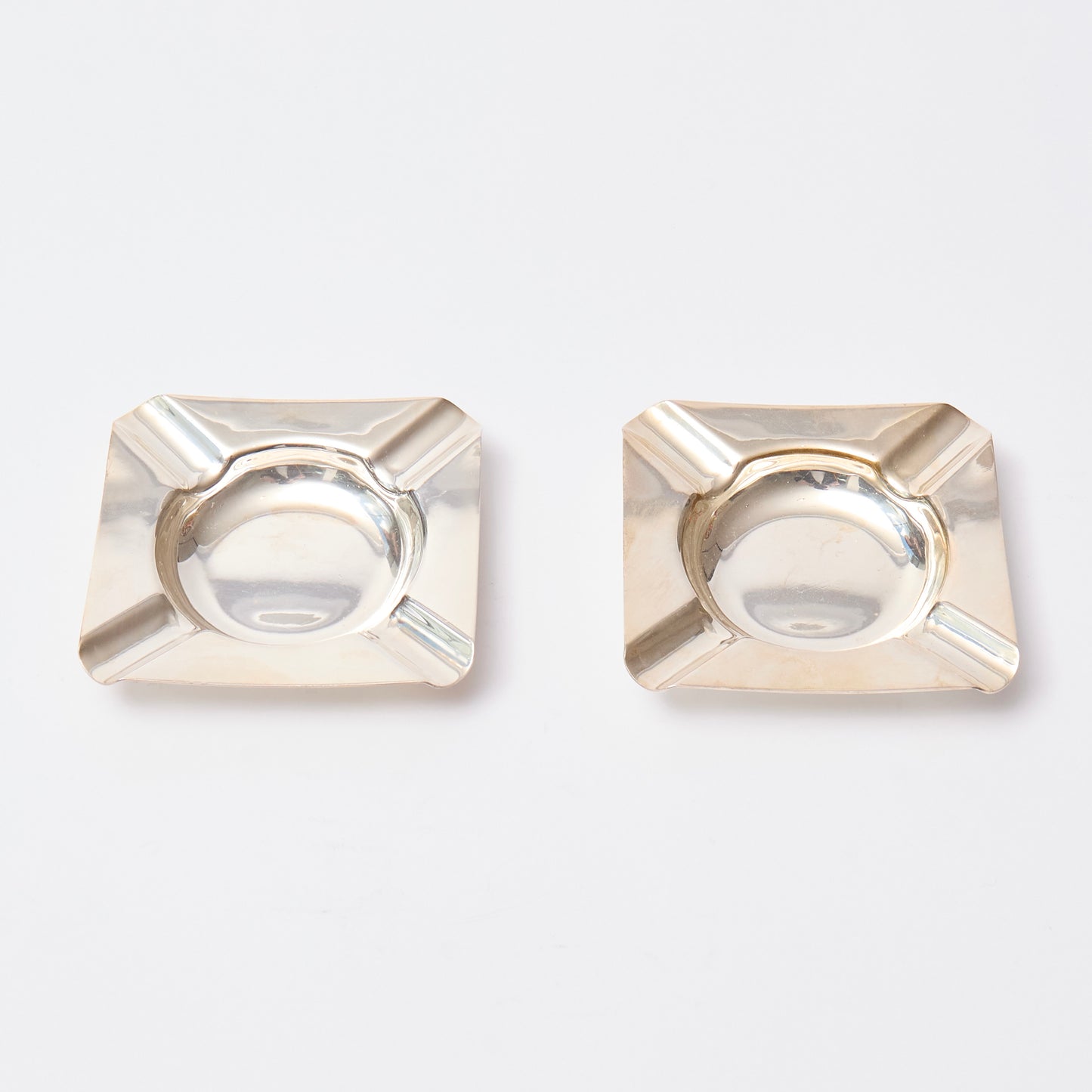Pair of small silver-plated square ashtrays